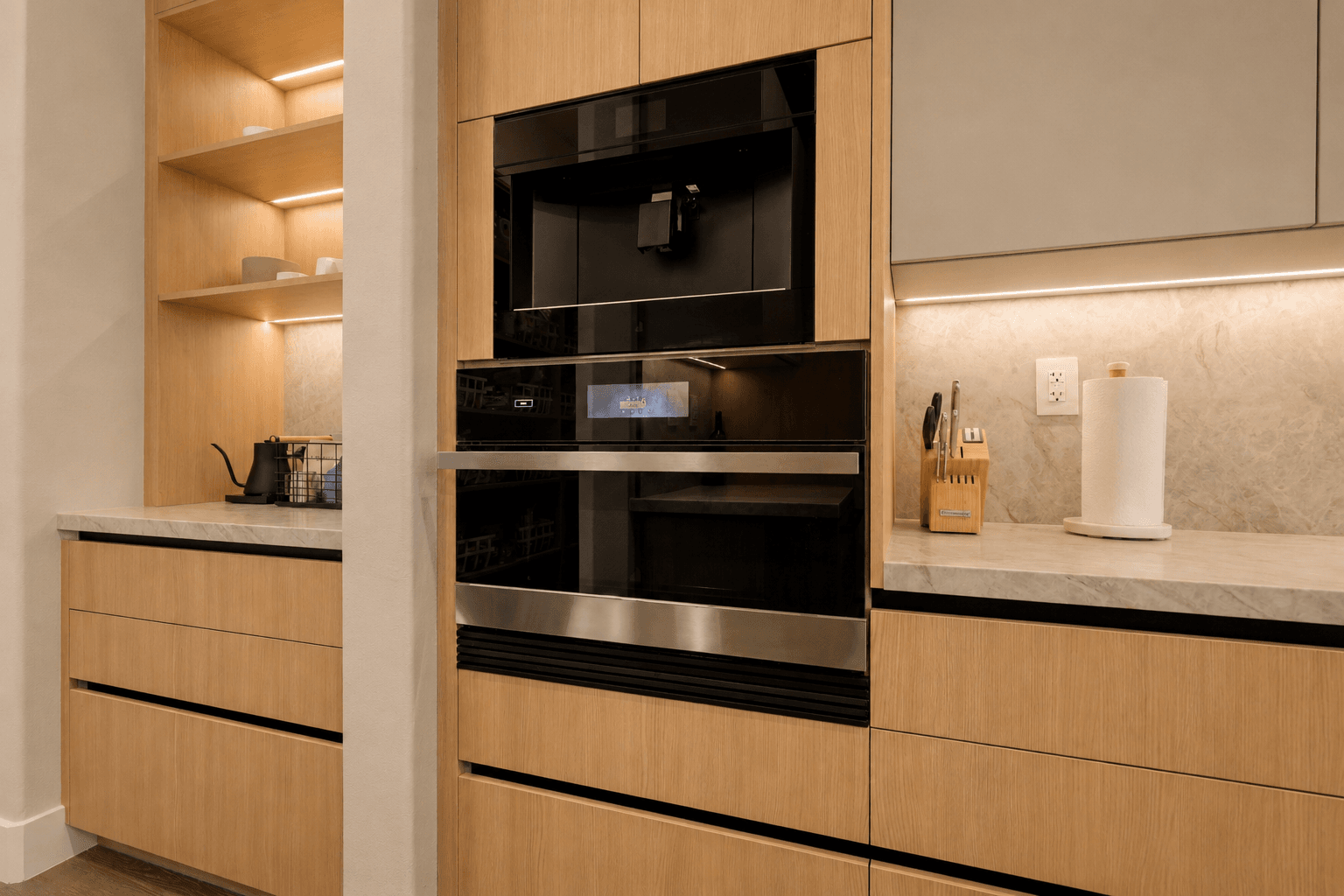 Built-in coffee station with oak cabinets and stainless steam oven