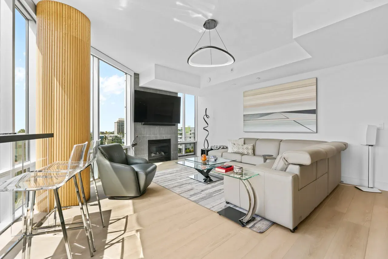 Modern condo living room remodel with floor-to-ceiling windows and wood-slat feature column